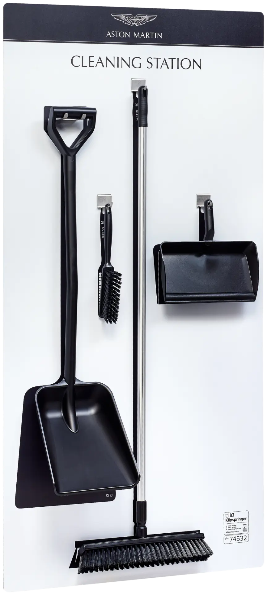 Aston Martin cleaning station with four black cleaning tools in clearly defined positions