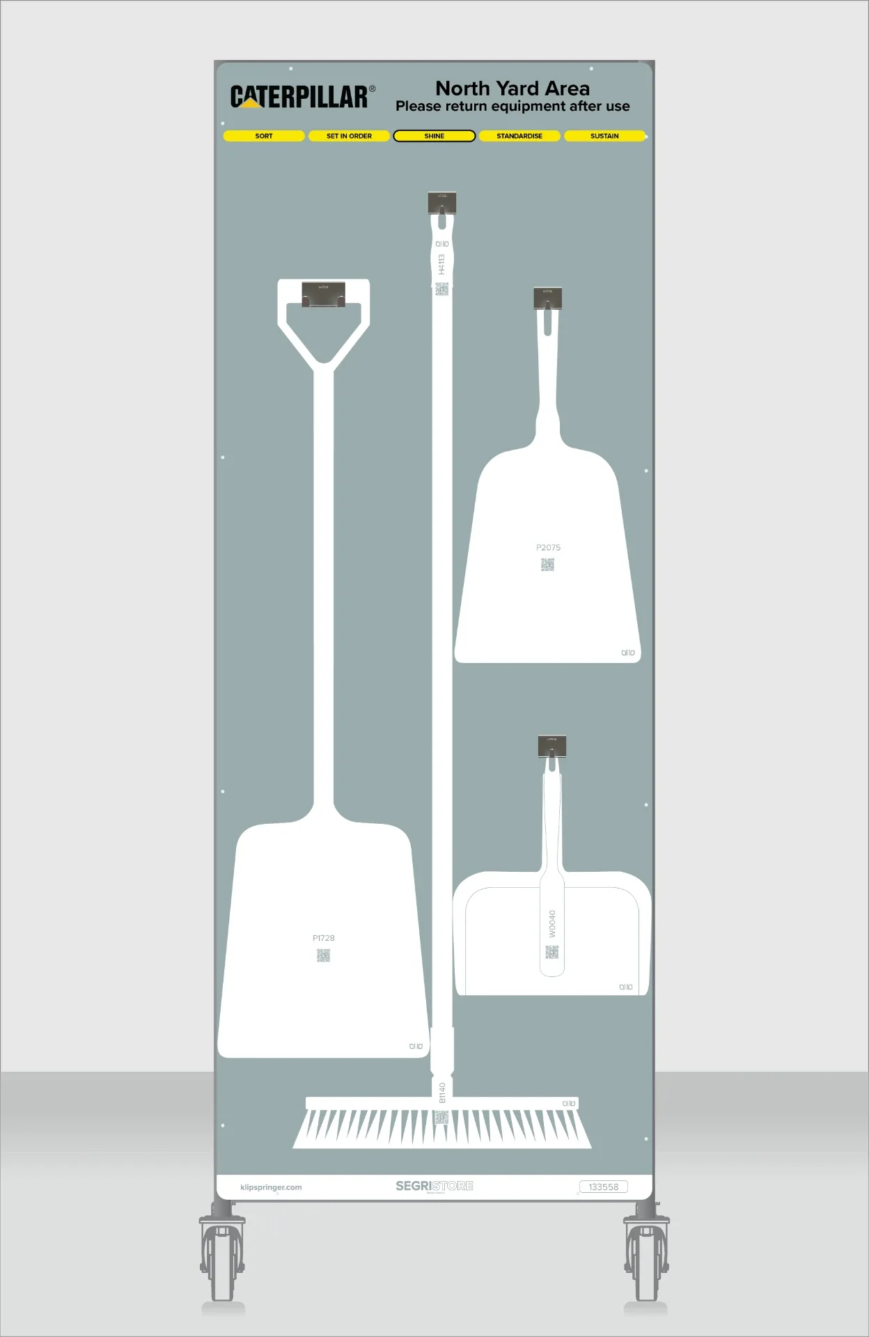 Tall mobile Caterpillar North Yard shadow board with labelled positions for long-handled rakes, paddles and scrapers